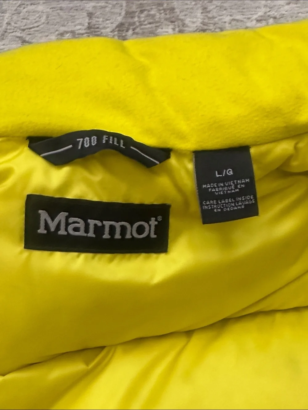 Marmot Men’s Large Gray and Yellow Puffy Down Vest. 700-fill.